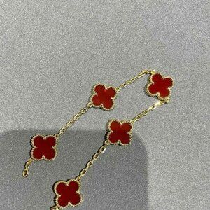 VC 18K gold bracelet with 5 motifs adorned with tiger's eye pla